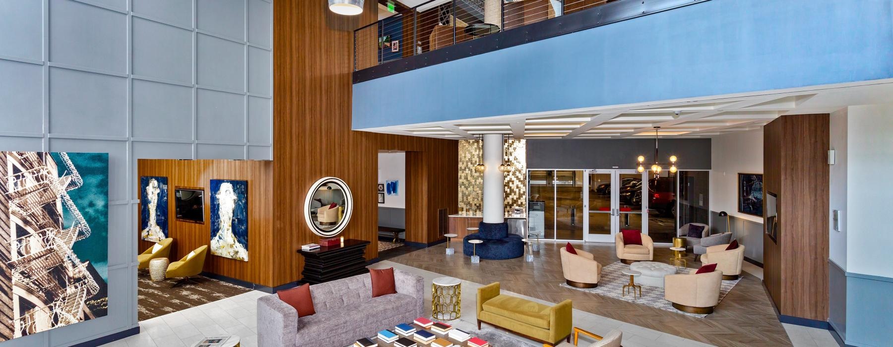 a room with seating and tables