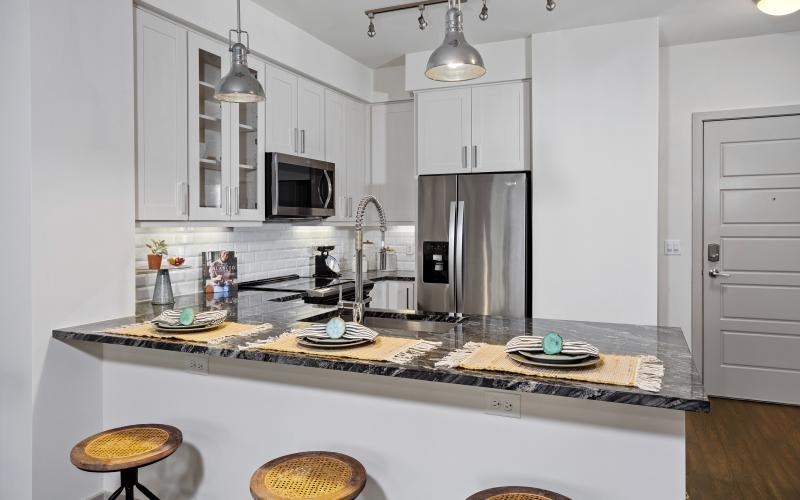 a kitchen with a marble countertop