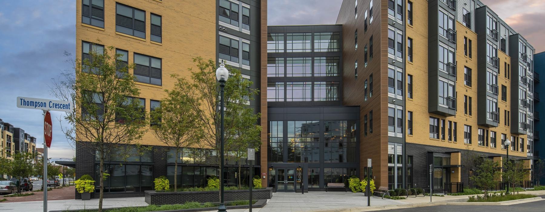 a large building with trees in front of it